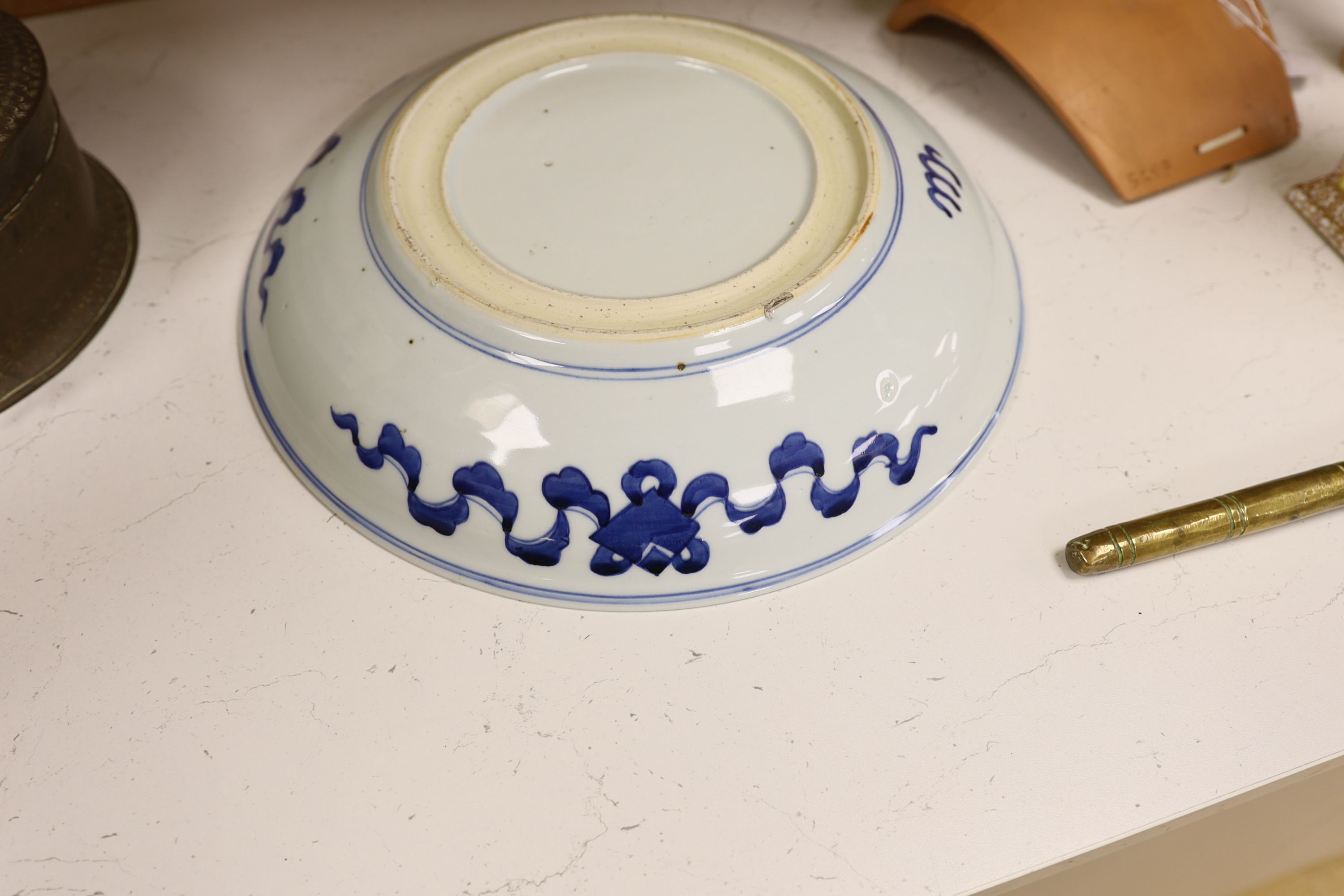 A Chinese blue and white ‘Buddhist lion’ dish, channel moulded foot, 36cm diameter